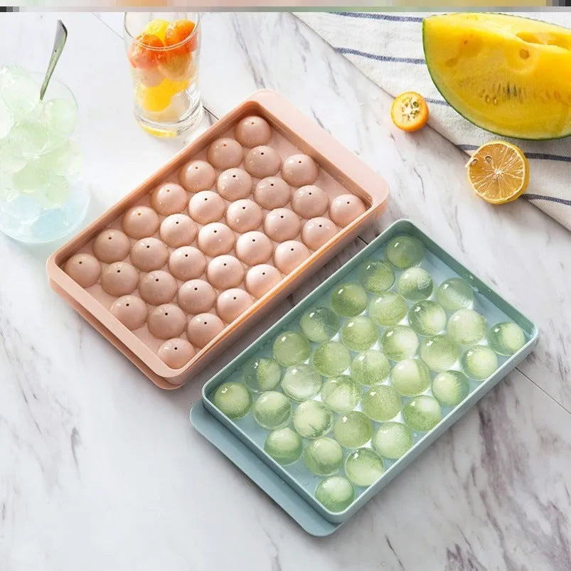 3D round ice moulds in sky blue or pink colours showing 18 and 33 grid options