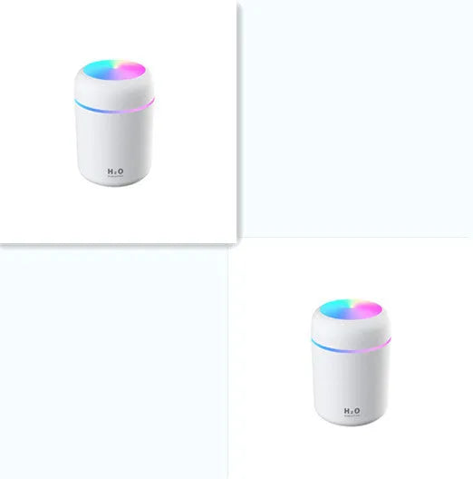 Pink car air purifying humidifier with LED lights on, next to a USB cable.