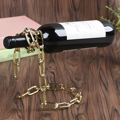 Golden chain wine shelf with European scrollwork hanging from ceiling, displaying three wine bottles