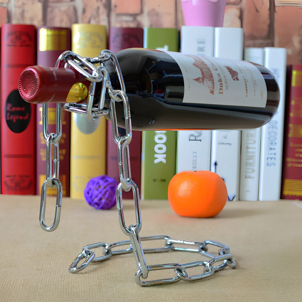 Golden chain wine shelf with European scrollwork hanging from ceiling, displaying three wine bottles