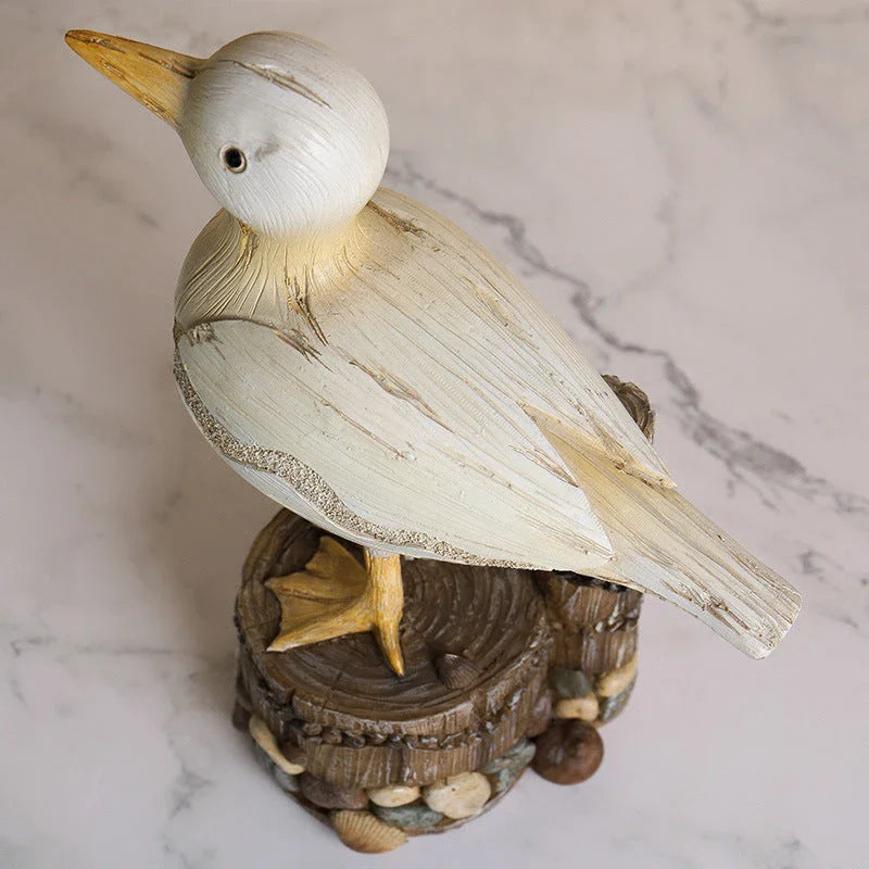 Realistic resin seagull statue with wooden stump base, perfect for coastal-inspired home decor