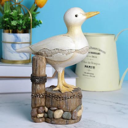 Realistic resin seagull statue with wooden stump base, perfect for coastal-inspired home decor