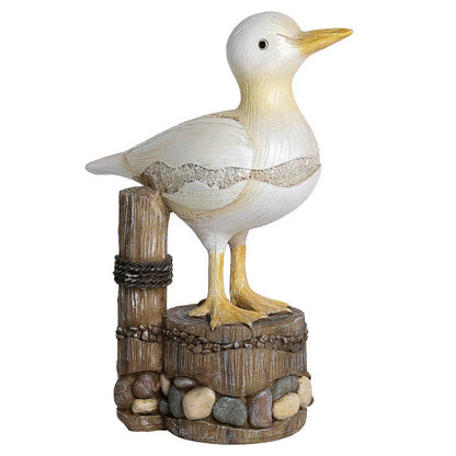 Realistic resin seagull statue with wooden stump base, perfect for coastal-inspired home decor