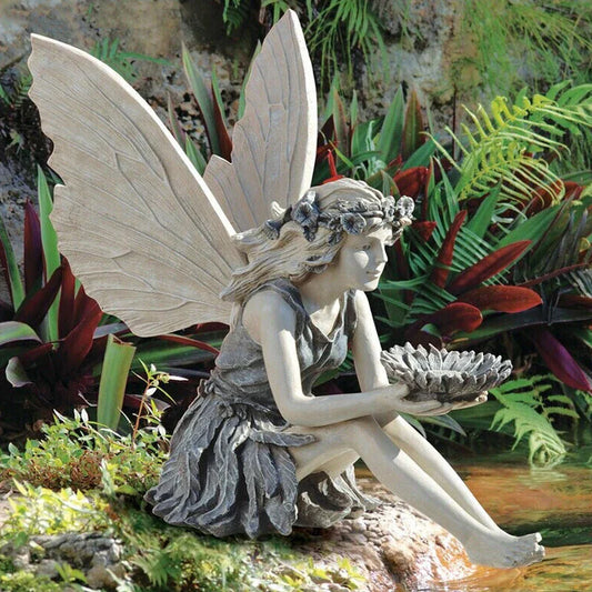 A charming resin fairy statue holding a sunflower bowl, with a flower crown and petal-inspired skirt, designed for outdoor garden decor