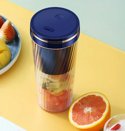 Green portable fruit juicer with 350ml capacity cup and 600ml pulp residue box