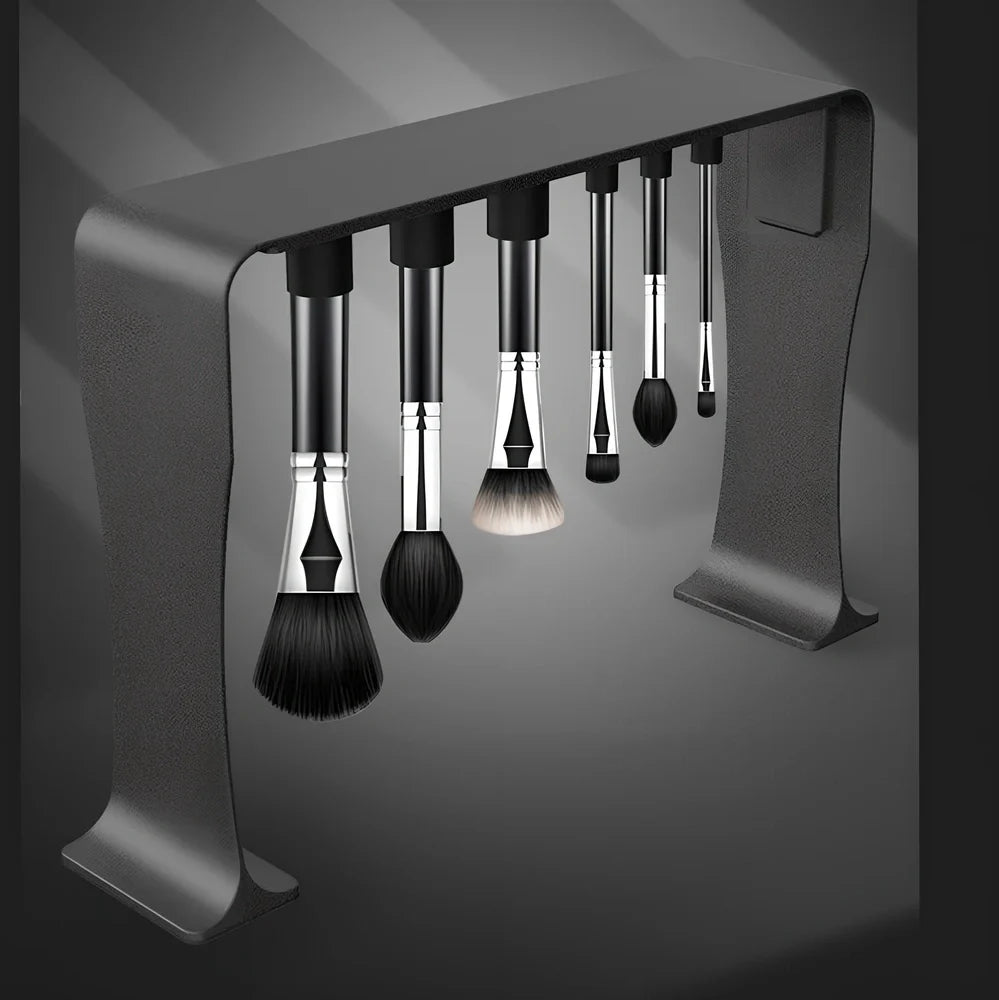 Black magnetic make-up brush drying rack with 12 silicone caps on desktop