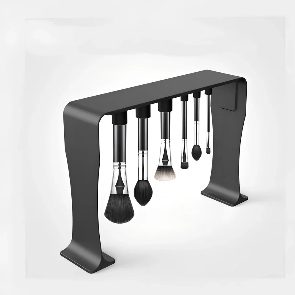 Black magnetic make-up brush drying rack with 12 silicone caps on desktop
