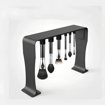 Black magnetic make-up brush drying rack with 12 silicone caps on desktop