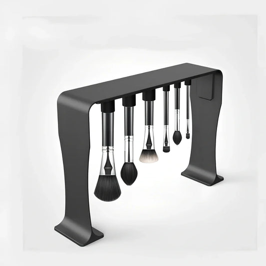 Black magnetic make-up brush drying rack with 12 silicone caps on desktop