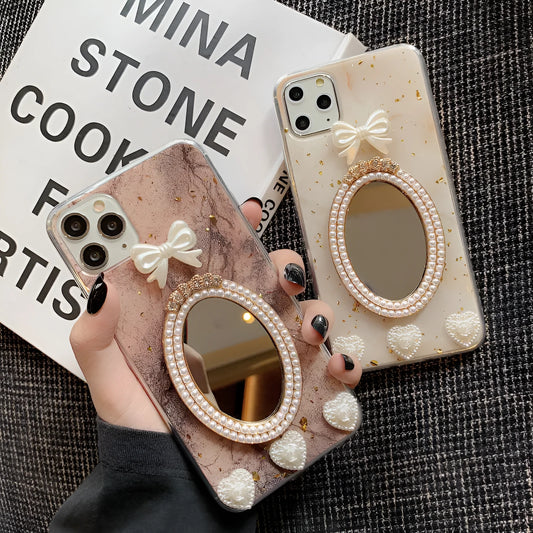 Brown marble pattern iPhone case with a rhinestone bowknot and a mirror on the back.