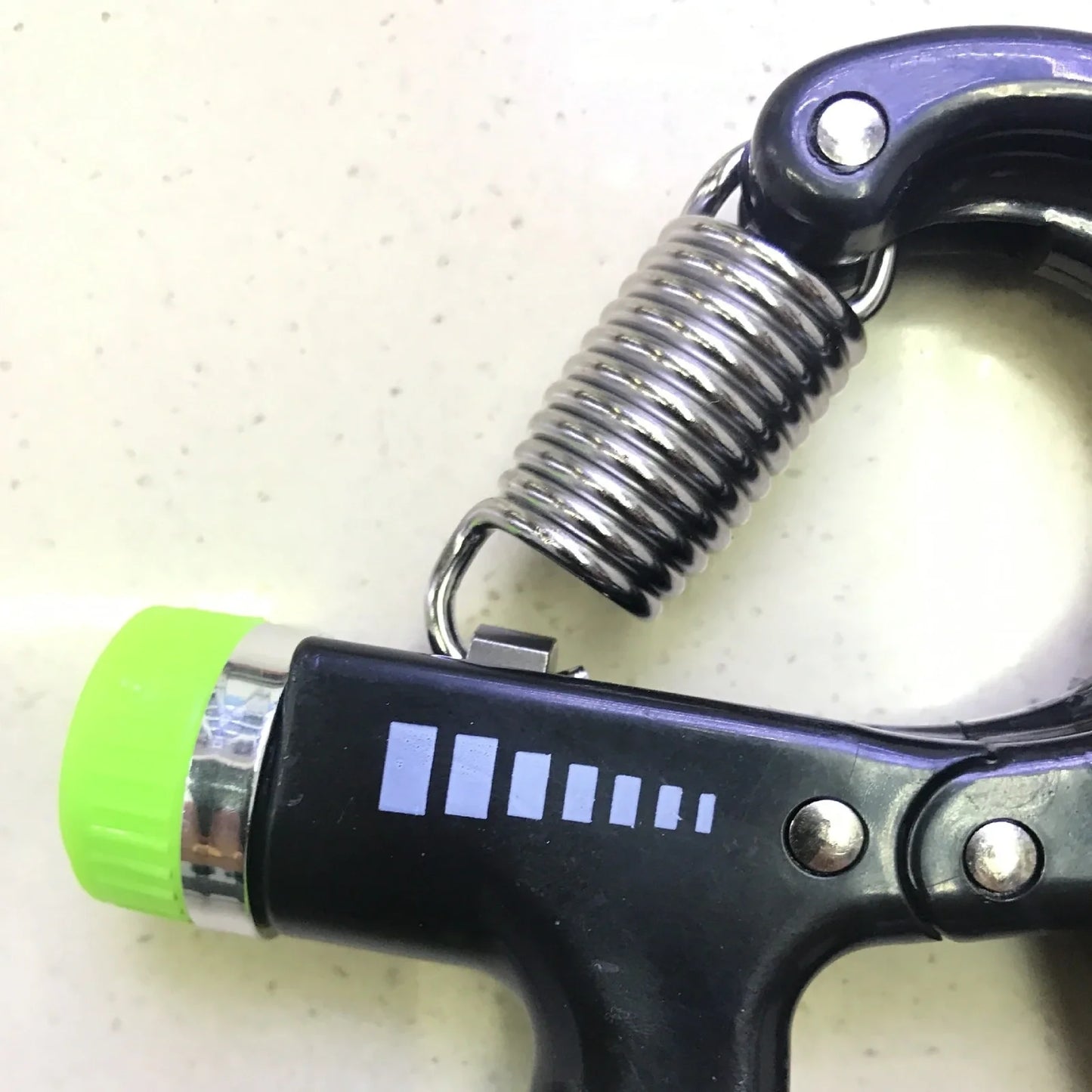 Adjustable hand gripper with digital display showing repetition count and resistance dial