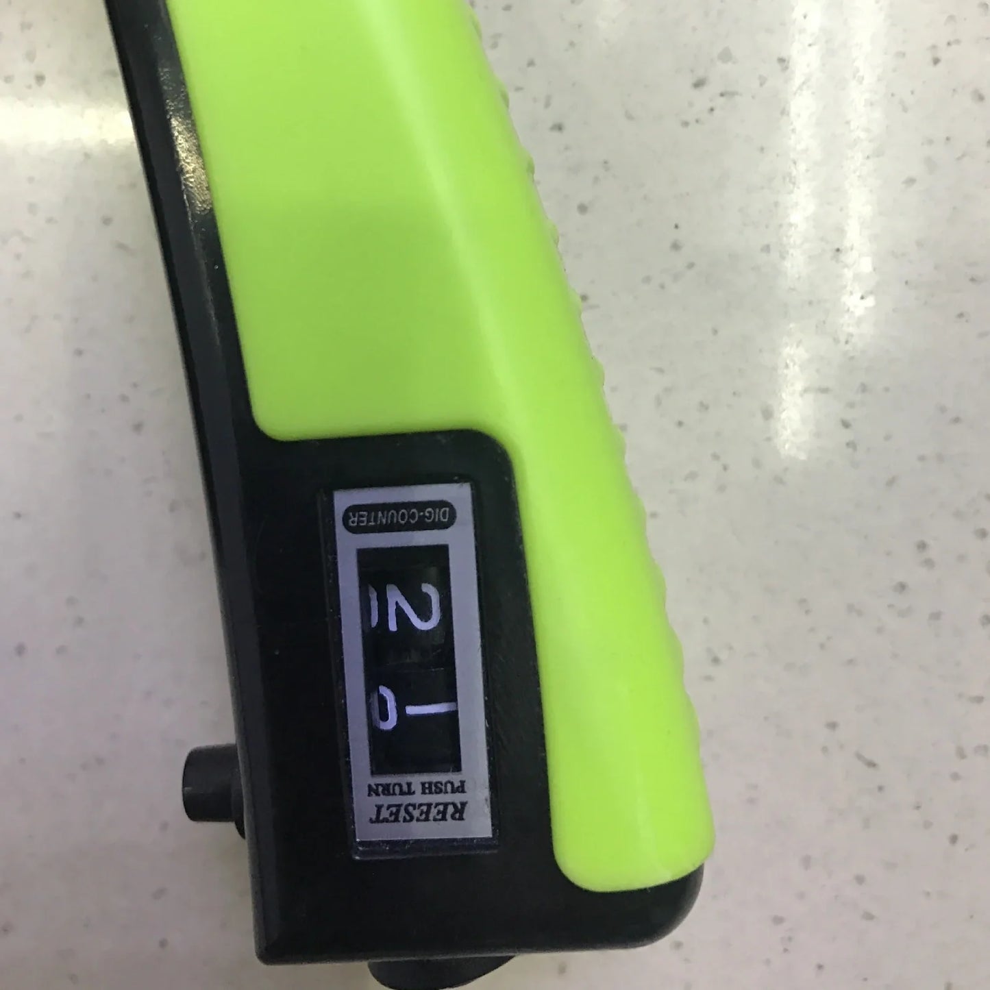 Adjustable hand gripper with digital display showing repetition count and resistance dial