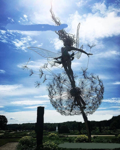 Enchanting metal fairy garden sculptures in the shape of fairies and pixies dancing on dandelions, designed for year-round outdoor or indoor display