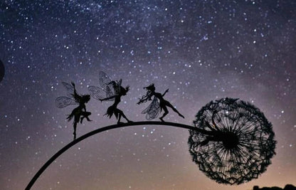 Enchanting metal fairy garden sculptures in the shape of fairies and pixies dancing on dandelions, designed for year-round outdoor or indoor display