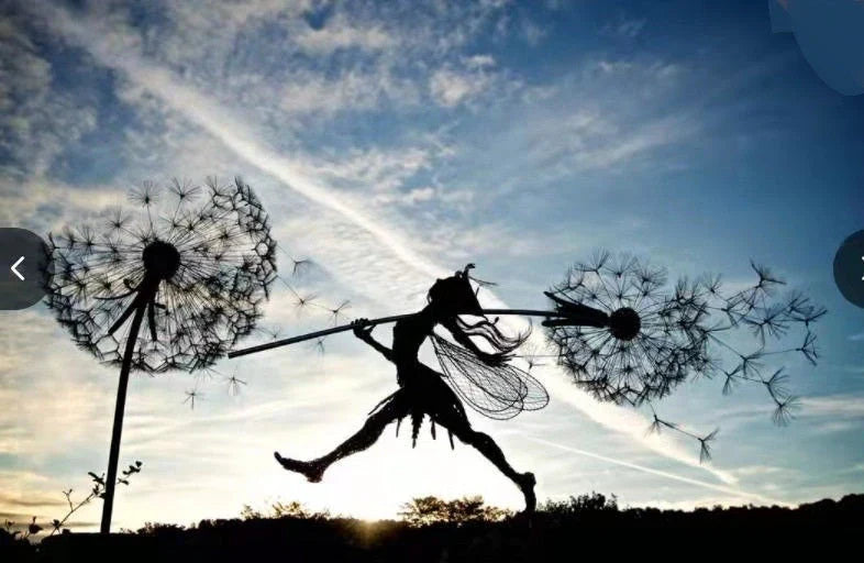 Enchanting metal fairy garden sculptures in the shape of fairies and pixies dancing on dandelions, designed for year-round outdoor or indoor display