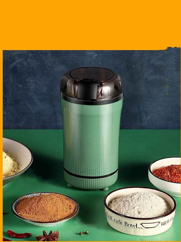 Small household grinder in green or white colour with 120g capacity for milling grains and coffee beans
