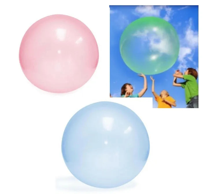 Large pink, yellow, green, and blue inflatable bouncy balls in various sizes for children's play.