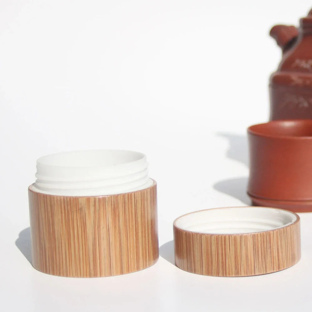 Handmade bamboo cosmetics bottle with hand-polished surface and natural grain texture