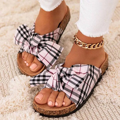 Summer ladies sandals with bowknot and leopard print design, available in pink, white, and khaki.