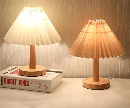 Vintage-inspired desk lamp with a pleated fabric shade, bamboo base, and touch-sensitive dimming controls