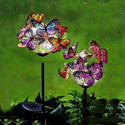 Solar-powered LED butterfly garden lights in black and transparent colors, creating a magical outdoor lighting display