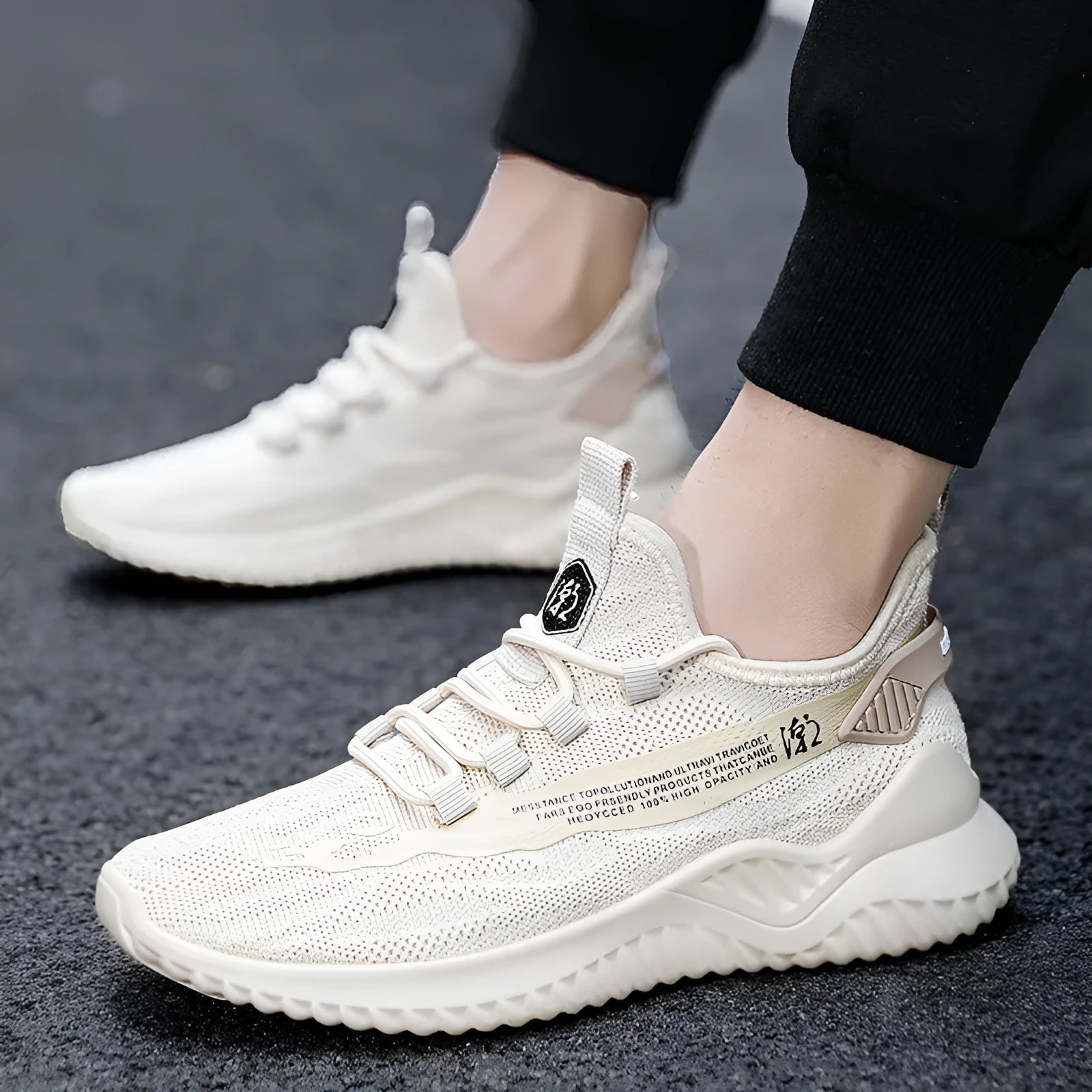 Men's white mesh sports shoes with round toe design and rubber sole, showing front tie closure and low upper height