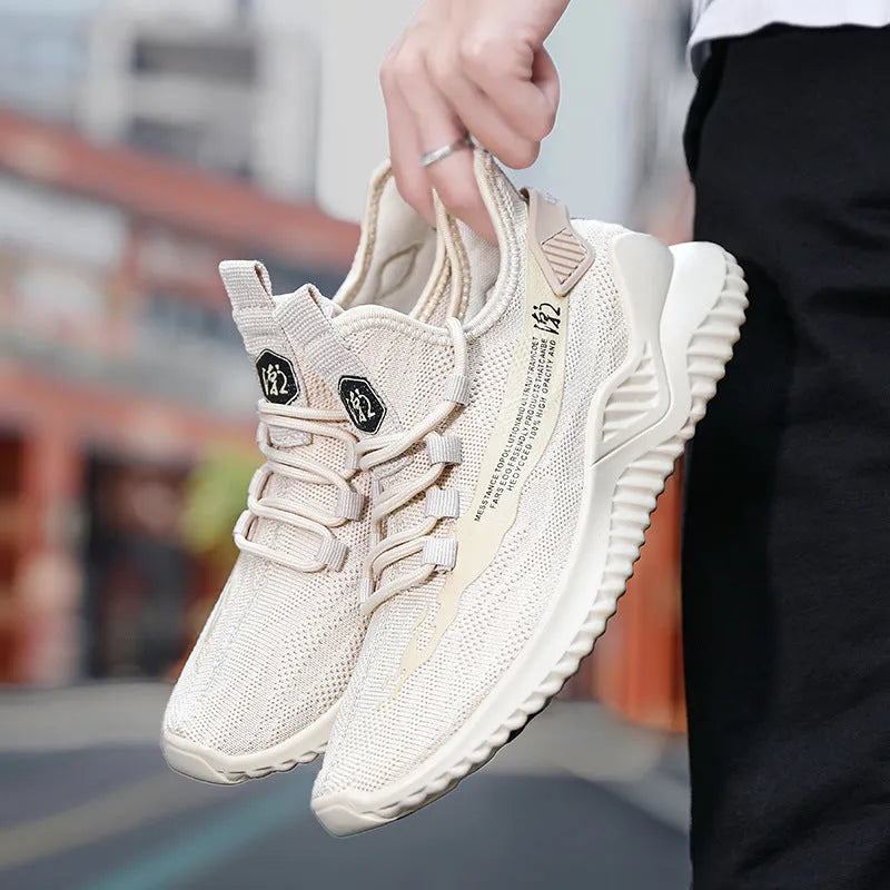 Men's white mesh sports shoes with round toe design and rubber sole, showing front tie closure and low upper height