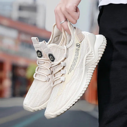 Men's white mesh sports shoes with round toe design and rubber sole, showing front tie closure and low upper height