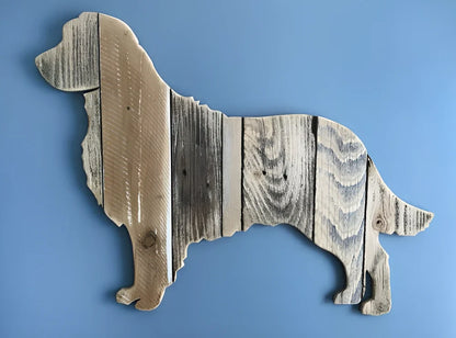 Handcrafted wooden dog breed decoration showing manual carving details on solid wood