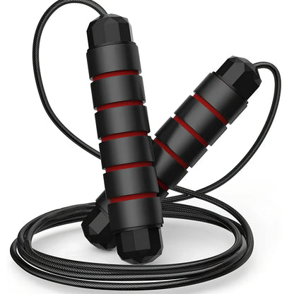 Steel core skipping rope with red handles, PVC coating, and adjustable length mechanism for fitness training
