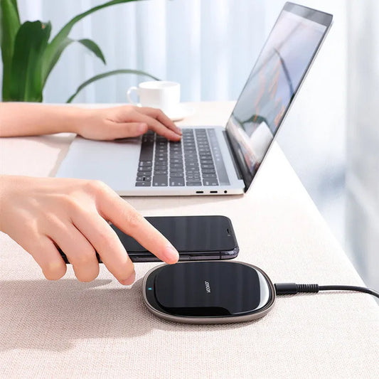 Black wireless charging pad with zinc alloy body and glass surface measuring 99.2mm square
