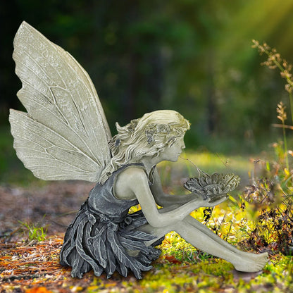 A charming resin fairy statue holding a sunflower bowl, with a flower crown and petal-inspired skirt, designed for outdoor garden decor