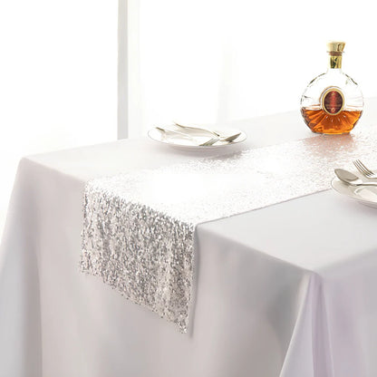 Polyester table runner with Gypsophila embroidery and sequin detailing in beige colour on wooden table