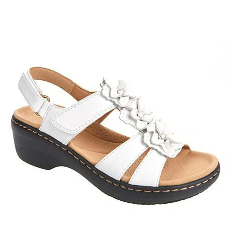 Stylish flower-adorned sandals with comfortable wedge heel in various colors