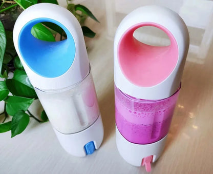 Red electric lemon juicer with round feeding port and manual operation mechanism