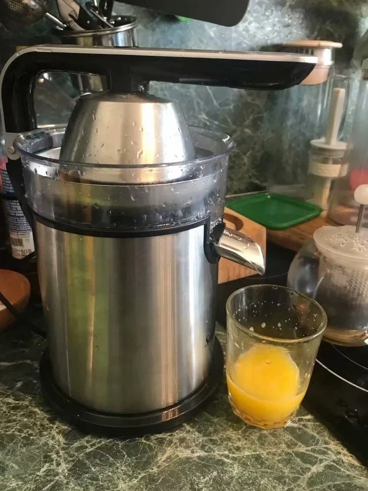 Red electric lemon juicer with round feeding port and manual operation mechanism