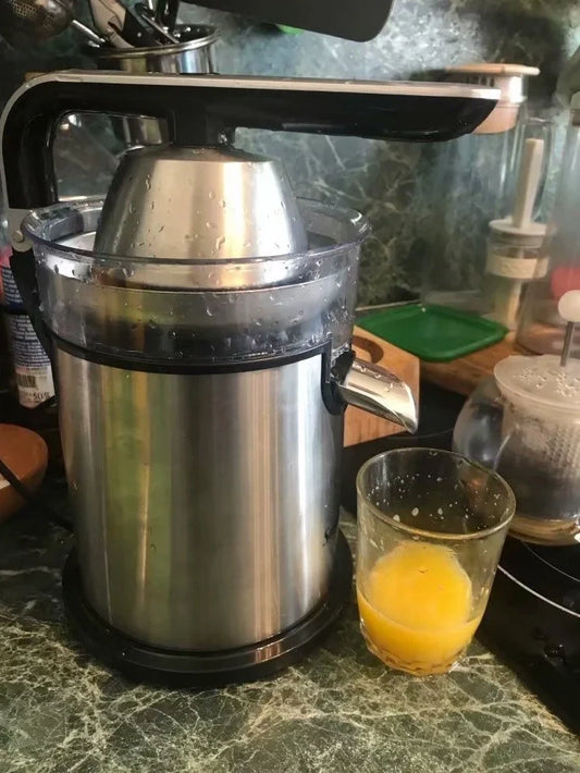 Red electric lemon juicer with round feeding port and manual operation mechanism