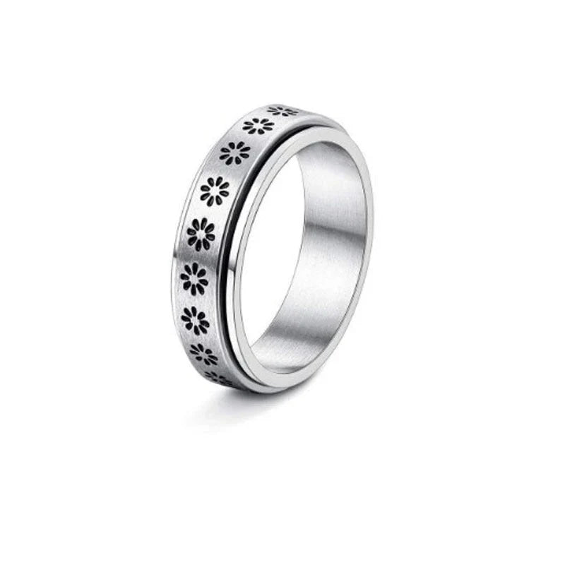 Stainless steel spinner ring with intricate moon and stars design
