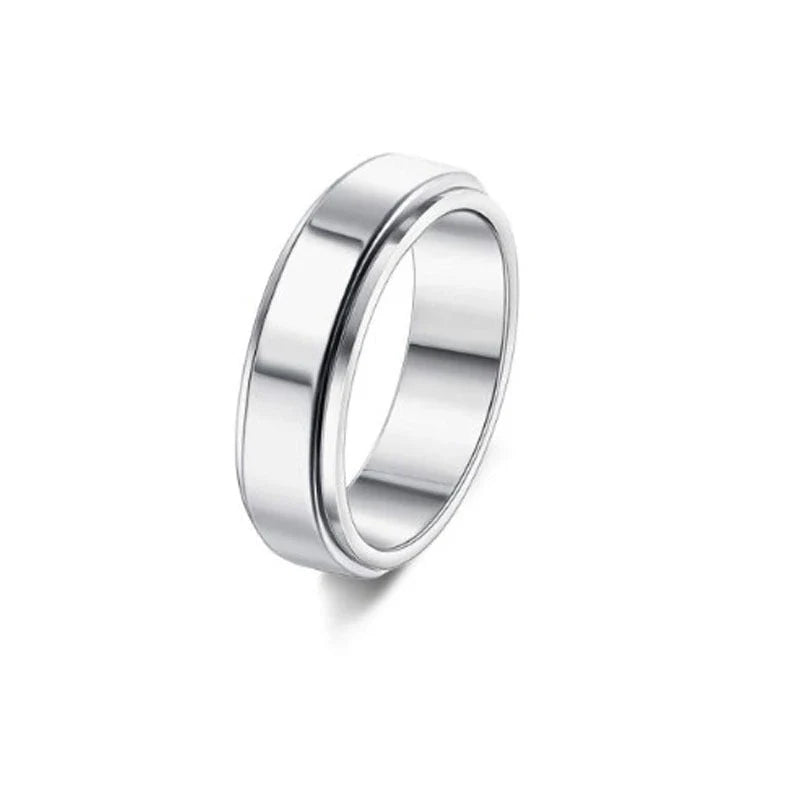 Stainless steel spinner ring with intricate moon and stars design