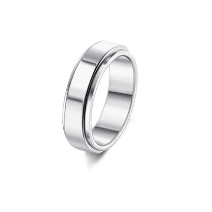 Stainless steel spinner ring with intricate moon and stars design
