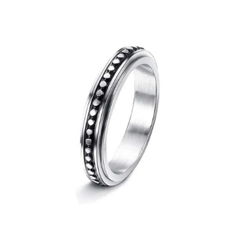 Stainless steel spinner ring with intricate moon and stars design