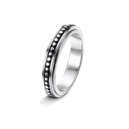 Stainless steel spinner ring with intricate moon and stars design