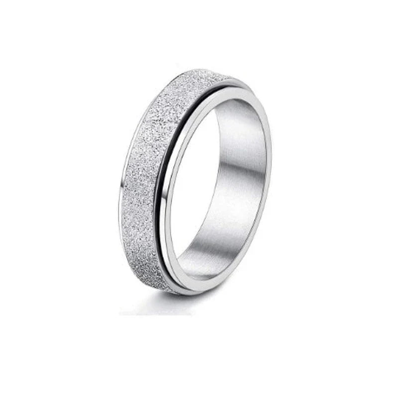 Stainless steel spinner ring with intricate moon and stars design