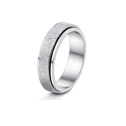 Stainless steel spinner ring with intricate moon and stars design