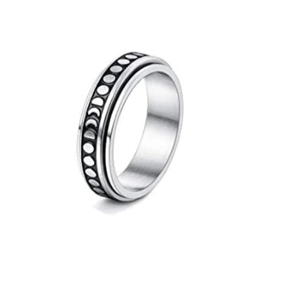 Stainless steel spinner ring with intricate moon and stars design