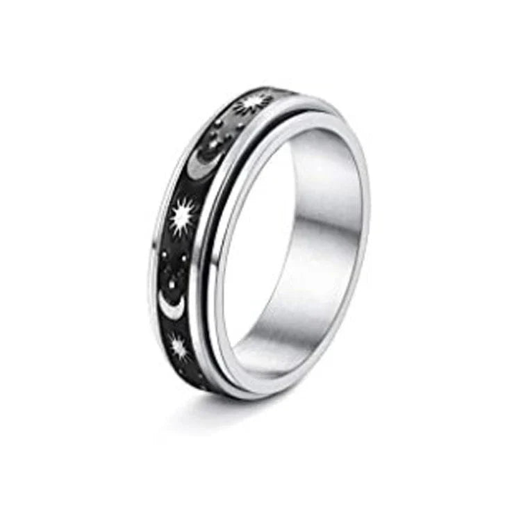 Stainless steel spinner ring with intricate moon and stars design