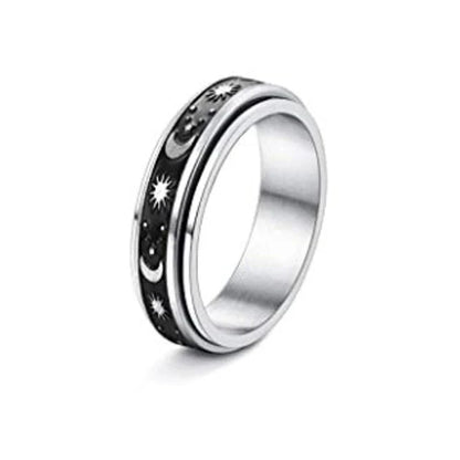 Stainless steel spinner ring with intricate moon and stars design
