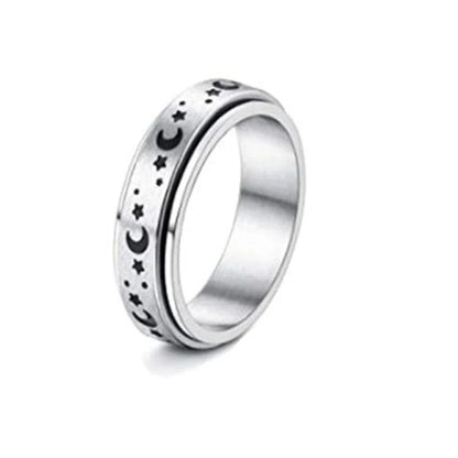 Stainless steel spinner ring with intricate moon and stars design
