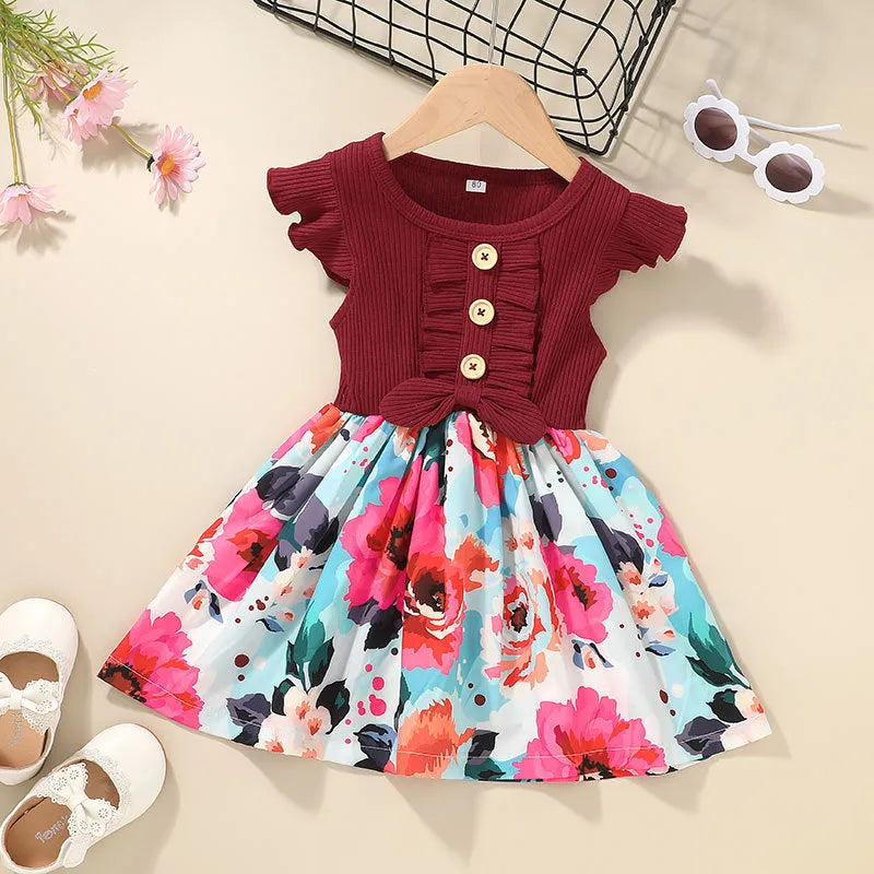 Toddler girl in a sleeveless summer dress, shown in one of six available colours.