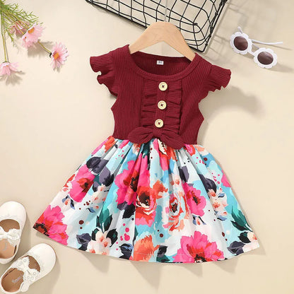 Toddler girl in a sleeveless summer dress, shown in one of six available colours.